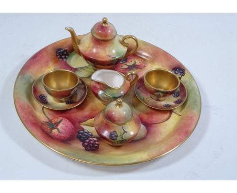 Caverswall miniature hand painted dolls tea for two, each decorated with fruit, signed by M. Bates, dated 1977    Condition R