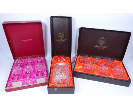 Webb crystal decanter, boxed, six matching tumblers, boxed, and another boxed set or six crystal wine glasses    Condition Re