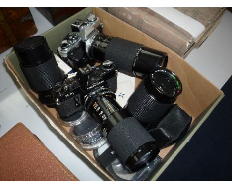 A PENTAX CAMERA AND LENS, and an Olympus camera and lens, together with other lens and accessories