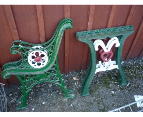 A PAIR OF PAINTED CAST IRON BENCH ENDS, and a similar pair of table supports (4)