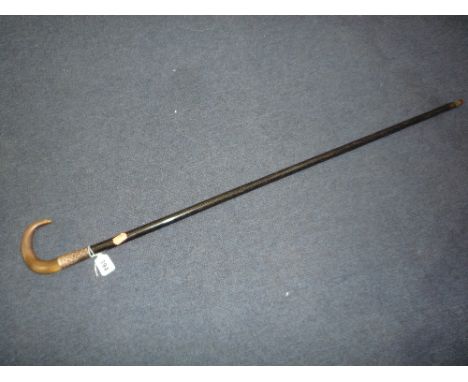 A SILVER COLLARED WALKING STICK