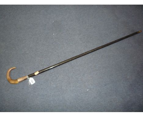 A SILVER COLLARED WALKING STICK