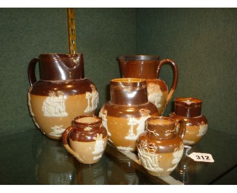 SIX VARIOUS DOULTON SALT GLAZED JUGS, of various heights, hunting ware design, impressed marks