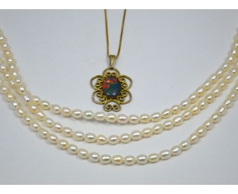 TWO ITEMS, to include an 18ct gold box chain with opal triplet pendant together with a three strand freshwater pearl necklace