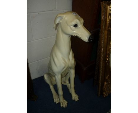 A CERAMIC LIFE SIZED MODEL, of a seated dog
