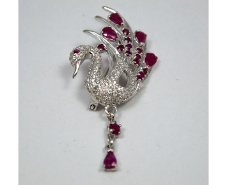 A BROOCH, depicting a swan with ruby and cubic zirconia detail, stamped 925
