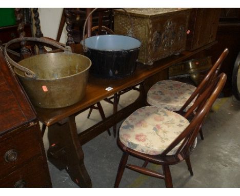 AN OAK REFRECTORY TABLE, and six dark Ercol chairs including two carvers (7)