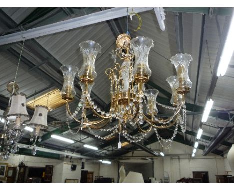 A BRASS EIGHT BRANCH CHANDALIER, a four branch table lamp and four double wall lights (6)