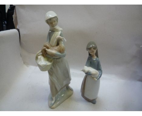 TWO LLADRO FIGURES, of girls holding a pig and a hen (2)