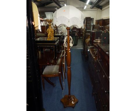 A WALNUT STANDARD LAMP, (no shade) and a decorative elephant table lamp (s.d.) (2)