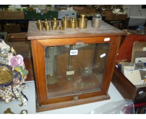 A CASED SET OF BALANCE SCALES AND VARIOUS WEIGHTS