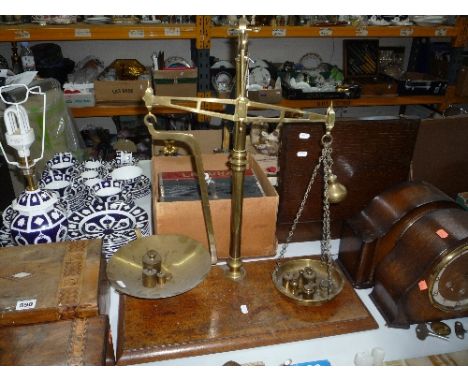 A SET OF BRASS BALANCE SCALES AND WEIGHTS
