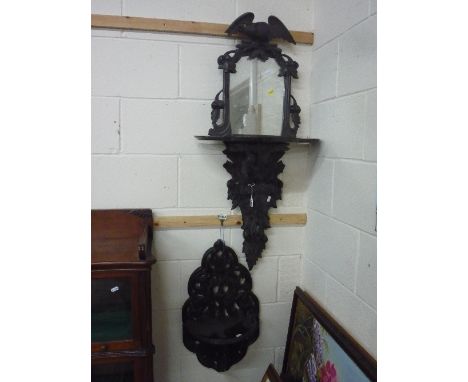 A VICTORIAN BLACK FOREST WALL MIRROR, with eagle mount and shelf and a similar wall shelf (2)