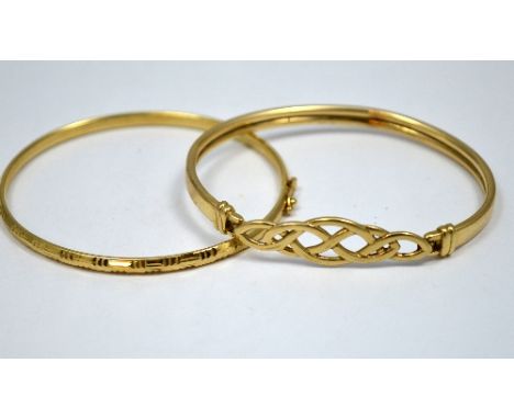 TWO BRACELETS, the first a Celtic bangle, the second with line engraved design, hallmarks to one bangle for 9ct gold