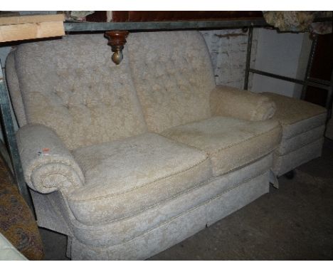 AN UPHOLSTERED FOUR PIECE SUITE, comprising of a two seater settee, pair of armchairs and a pouffe