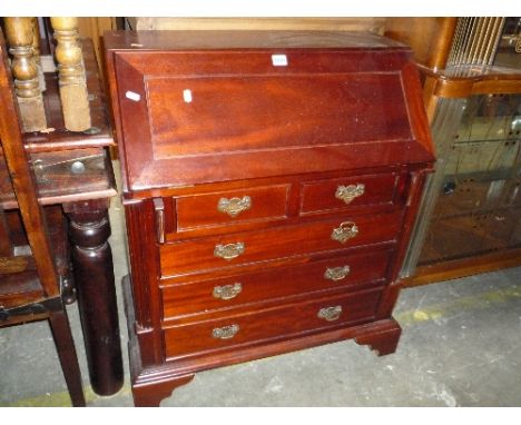 A MODERN MAHOGANY BUREAU, and a table lamp (2)