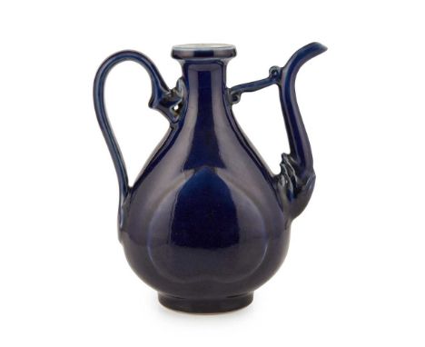 BLUE-GLAZED WINE EWER 19TH-20TH CENTURY   十九至二十世紀 藍釉執壺（缺蓋） the bulbous body moulded with a peach-shaped raised patch on eithe