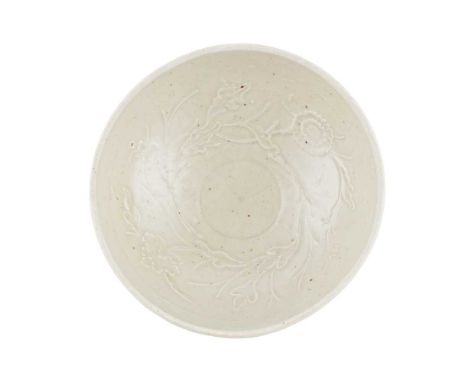 CELADON-GLAZED MOULDED 'CHRYSANTHEMUM AND PEONY' BOWL SOUTHERN SONG DYNASTY   南宋 景德鎮模印花卉紋碗 with rounded sides rested on short