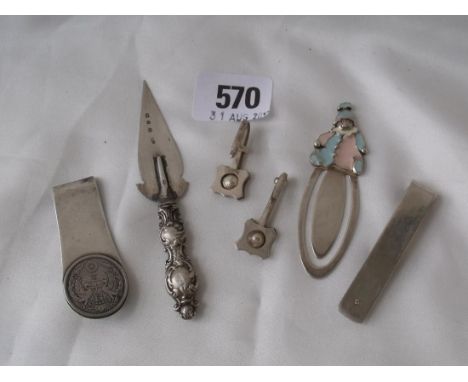 A trowel shaped bookmark Birm 1898 napkin clips etc  