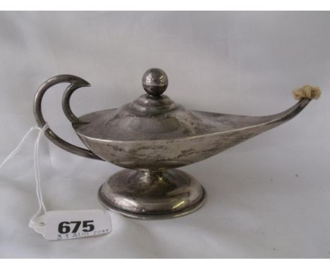 An Aladdin style lamp on spreading base Mexico silver  6” long         