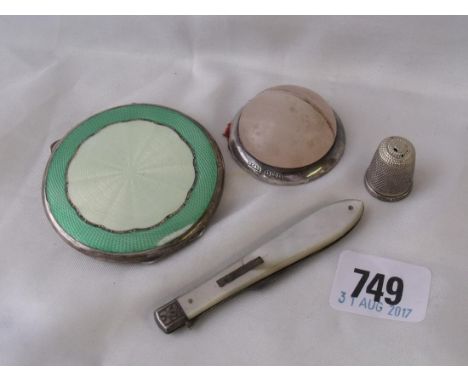 An enamel decorated compact a thimble mounted menu stand and a fruit knife      