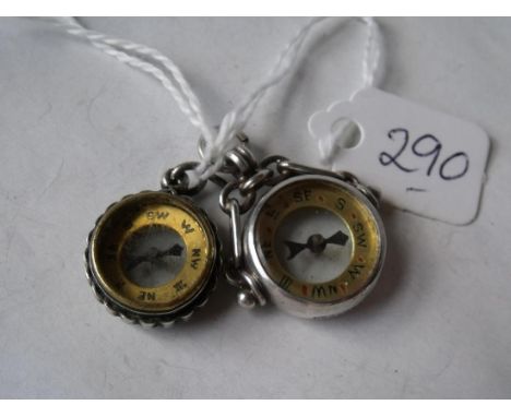 Two silver compass fobs