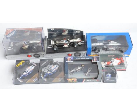 Collection of plastic and diecast David Coulthard themed Formula 1 racing car models to include 2 Auticalia (for Marks &amp; 