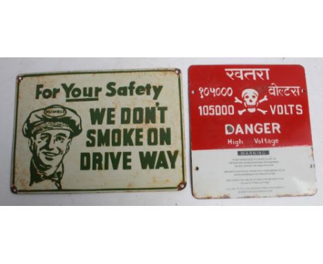 Two single sided enamel signs. 'We Don't Smoke on Driveway'.36cmx26cm. 'Danger High Voltage'. 26cmx28cm 