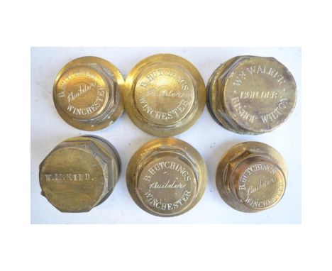 Collection of vintage brass coach and wheel nuts to include Austin, W M Kidd, B Hutchings and W M Walker stamped examples and