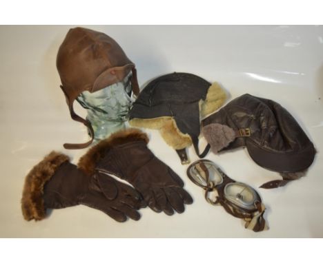 Two vintage fur/wool lined flying caps (both large) and an unlined leather flying/motoring cap (no size indicated, estimate s