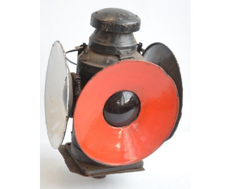 Vintage 4 way pole mounted railway lantern (missing paraffin burner). No makers marks, height with stowed handle approx 43cm 
