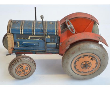 Vintage tinplate lithographed clockwork tractor model, marked Made In Great Britain but no makers marks (possibly Mettoy). Cl