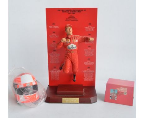 Hand painted cold cast 1/9th scale porcelain figurine of Michael Schumacher by Sheercast  with mahogany base and brass name p