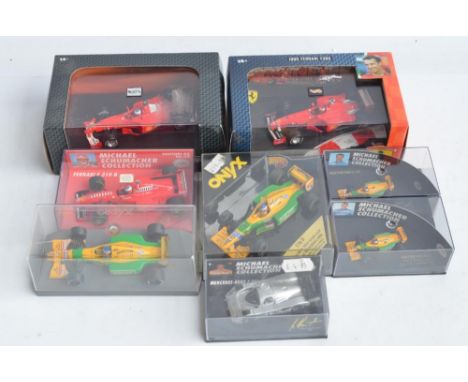 Collection of 8 diecast model racing car models in 1/43 and 1/87 scales to include 1/43 Hot Wheel Racing F1-2000 Rubens Baric