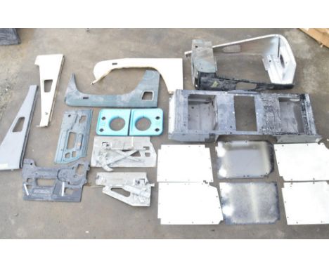 Collection of Land Rover Defender body panels and assemblies to include front right and left top and sides, transverse centre