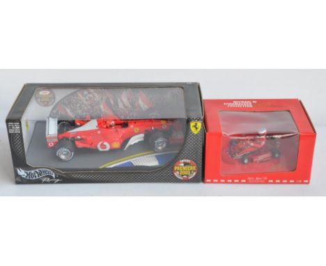 Two 1/18 scale diecast car models to include Hot Wheels 2003 Premier limited edition Michael Schumacher Collection Ferrari F1