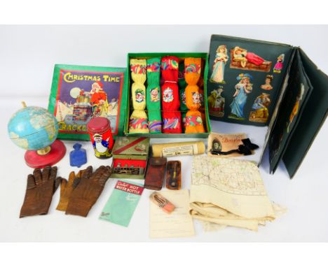 A collection of vintage items to include a box of Christmas crackers, pillar box form money bank, terrestrial globe and other