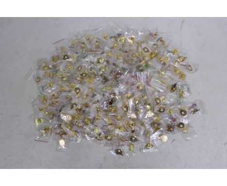 A quantity of Rupert The Bear related enamel pin badges, predominantly individually bagged. [W].