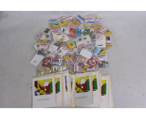 A good collection of Rupert The Bear related enamel pin badges, predominantly individually bagged. [W]