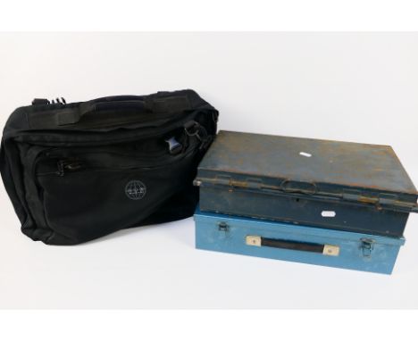 Two vintage metal tins, a German straight razor and a travel bag. [W]