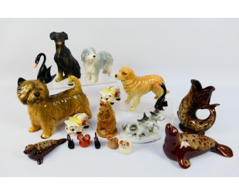 A collection of animal figures, ceramic and glass, to include Sylvac, Regency Fine Arts, Fosters and similar. [W]

NOTE: THIS