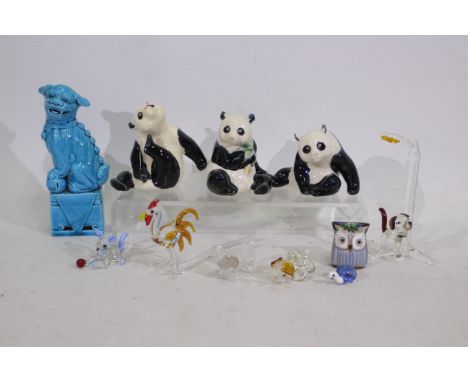 A lot including a Chinese blue mounted Fu dog. 3 x Chinese ceramic pandas. 6 x miniature glass animals. A porcelain owl. Larg