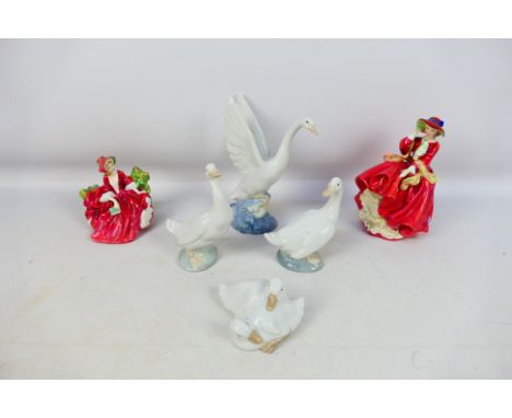 Four Nao bird studies and two Royal Doulton lady figures, largest approximately 21 cm (h). [W]