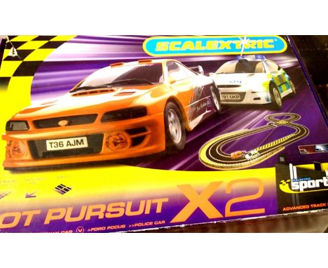 Scalextric Sport Hot Pursuit set, Ford Focus Police car and Subaru Impreza getaway car, appears complete in good condition, b