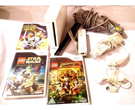 Nintendo Wii console in white, with two controllers, motion bar, power pack, AV connection lead and three games. P&amp;P Grou
