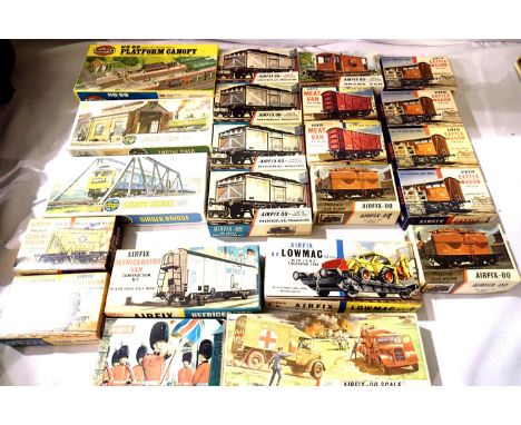 Twenty two Airfix OO scale plastic kit, mostly railway related, wagons, bridge, engine shed etc, appear complete, contents un