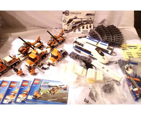 Lego Artic and Lowloader with helicopter tractor unit, two motorbikes and parts for Lego style railway set, contents unchecke