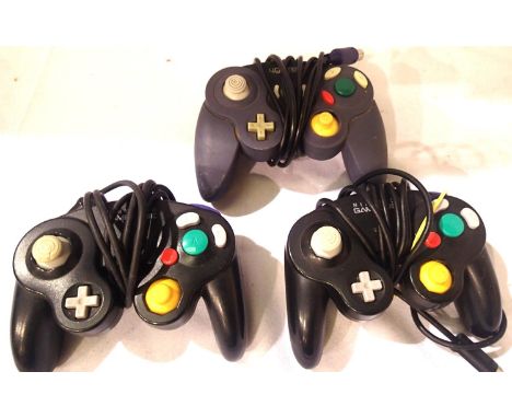 Two Nintendo GameCube controllers and one aftermarket controller. P&amp;P Group 1 (£14+VAT for the first lot and £1+VAT for s
