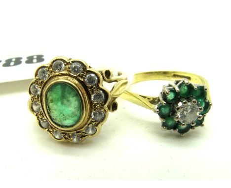 An 18ct Gold Emerald and Diamond Cluster Ring, of flowerhead design, claw set throughout, between tapered shoulders; Together