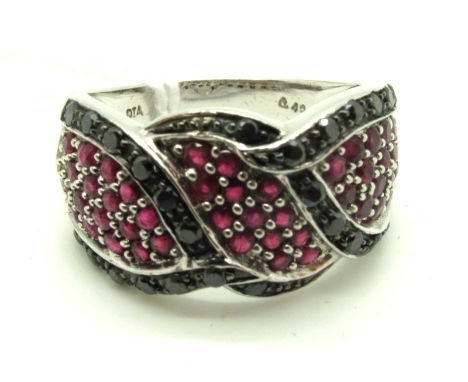 A Modern 9ct White Gold Ruby and Black Diamond Set Dress Ring, of wide shaped design.